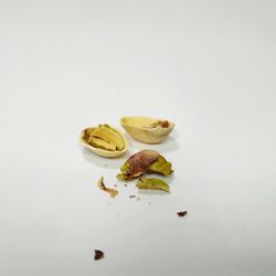 Close-up of fruits over white background