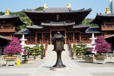 Statue of temple against building