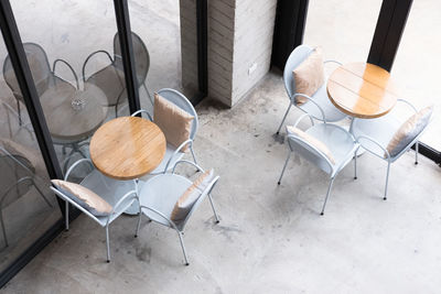 High angle view of empty chairs on table