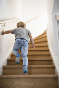 Boy going up stairs