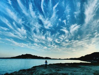 Scenic view of sea against cloudy sky