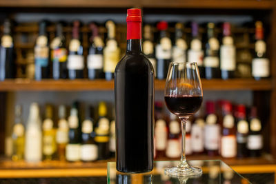 Close-up of wine bottles on table