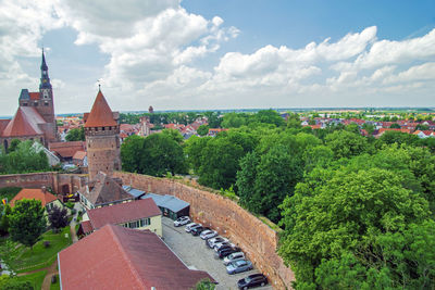 High angle view of trees and buildings against sky