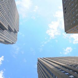 Low angle view of building against cloudy sky