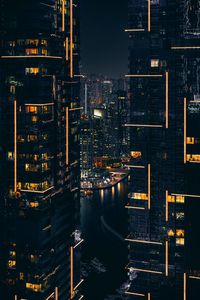 High angle view of illuminated buildings in city at night