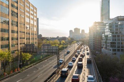 Brooklyn queen expressway with traffic on one side. buildings surrounding highway