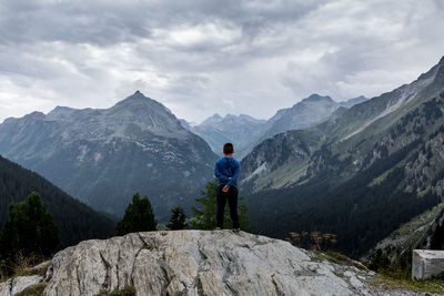 Boy standing on mountain