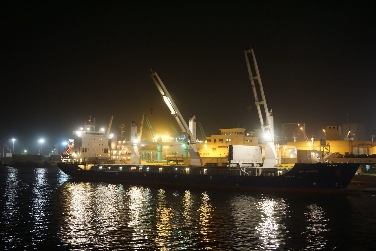 BOATS MOORED AT HARBOR