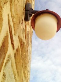 Low angle view of hanging against sky