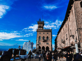 Group of people in front of buildings in city