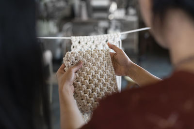 Close-up of woman holding wool