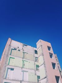 Low angle view of built structure against blue sky