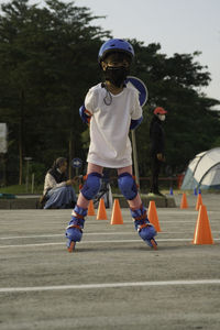 Full length of children running on road