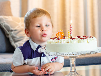 Cute boy with chocolate cake