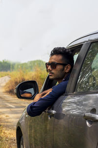 Portrait of young man wearing sunglasses