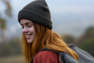 Portrait of smiling young woman wearing beanie