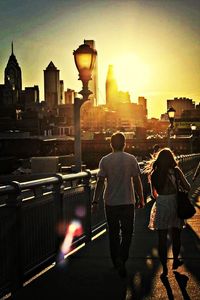 Rear view of people standing in city