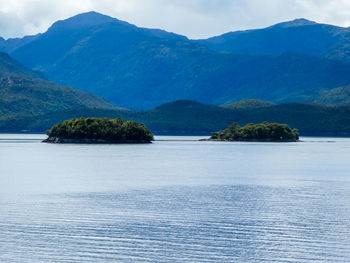 Small islands in front of mountains in patagonia