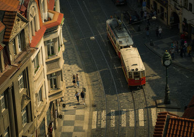 High angle view of people walking on city street