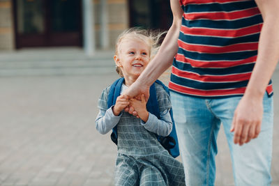 Mother and son on daughter outdoors