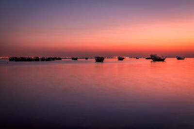 Scenic view of sea against sky at sunset