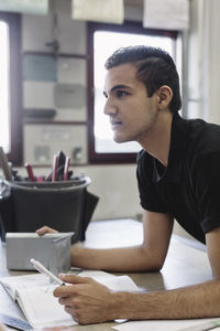 Young high school student with project in training class