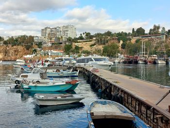 Boats moored at harbor