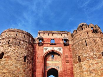 Low angle view of historical building against blue sky