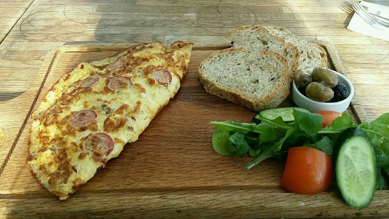 food, bread, table, food and drink, freshness, high angle view, wood - material, cutting board, no people, healthy eating, indoors, close-up, chopping board, ready-to-eat, day