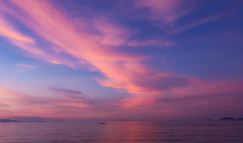 Scenic view of sea against romantic sky at sunset