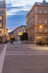 Road passing through city buildings