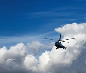 Low angle view of airplane flying in sky