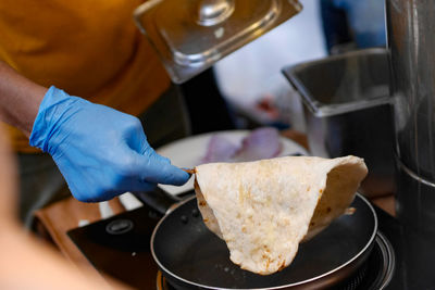 Midsection of man preparing food