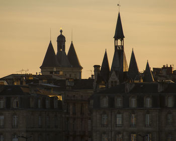 Historic building against sky during sunset