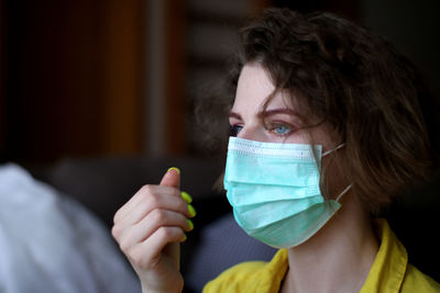 Portrait of young woman wearing medical mask durring pandemia