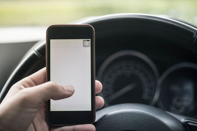 Close-up of hand using mobile phone