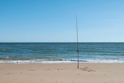 Scenic view of beach against clear sky