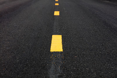 High angle view of arrow sign on road