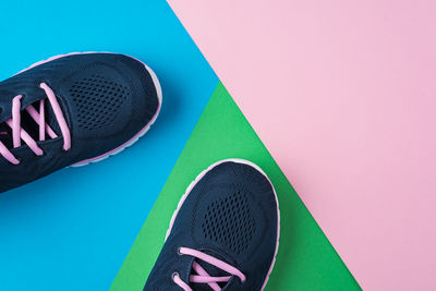 High angle view of shoe on pink background