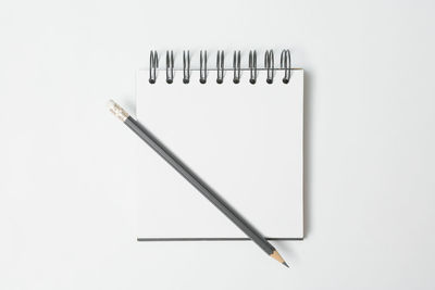 High angle view of pencil on white background