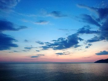 Scenic view of sea against sky at sunset