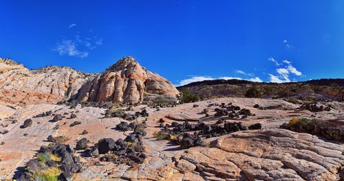 Scenic view of rocky mountains against clear blue sky