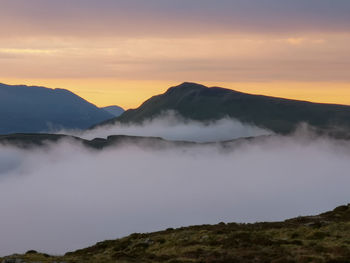 Scenic view of mountains against sky during sunset