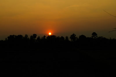 Scenic view of silhouette trees against sky during sunset