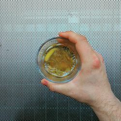 Close-up of hand holding tea cup