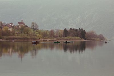 Boats in calm lake