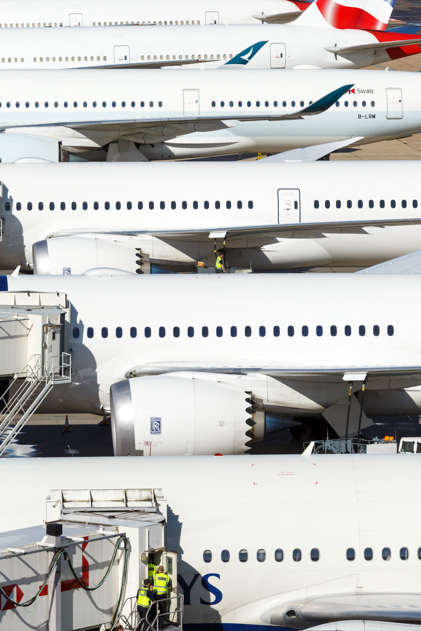 HIGH ANGLE VIEW OF AIRPLANE ON AIRPORT