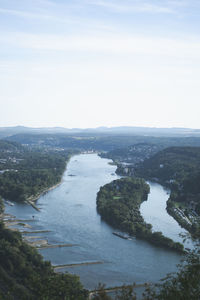 High angle view of river amidst trees against sky