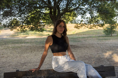 Beautiful italian girl at the park, wearing a dress