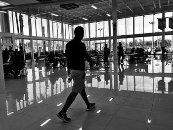 Man walking in airport lobby